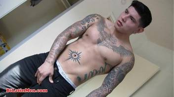Tatted gay Latin man jerking off